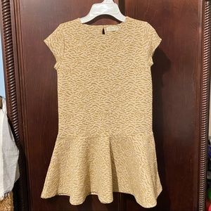 A floral, shinny, gold, dress for kids, girls.